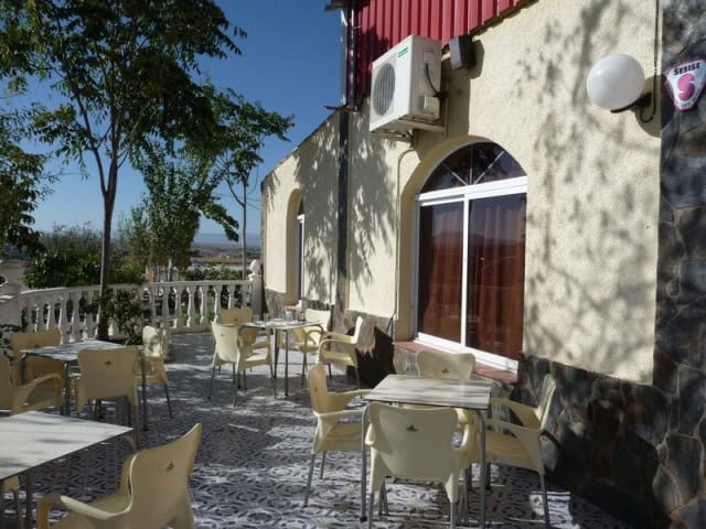 Commercial property in Benamaurel, Granada with outdoor terrace and seating.