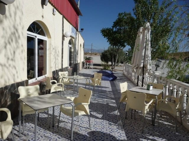 Commercial property in Benamaurel, Granada with outdoor seating area.