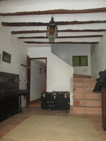 Traditional interior with wooden beams and rustic decor in Quesada, Jaen.