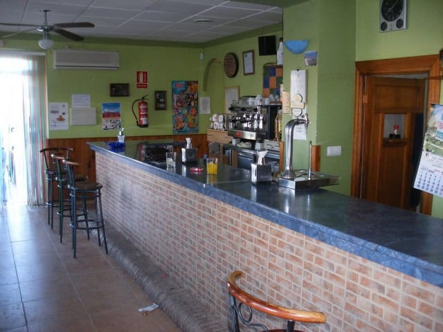 Commercial bar in Las Vertientes, Granada with seating area and vibrant decor.