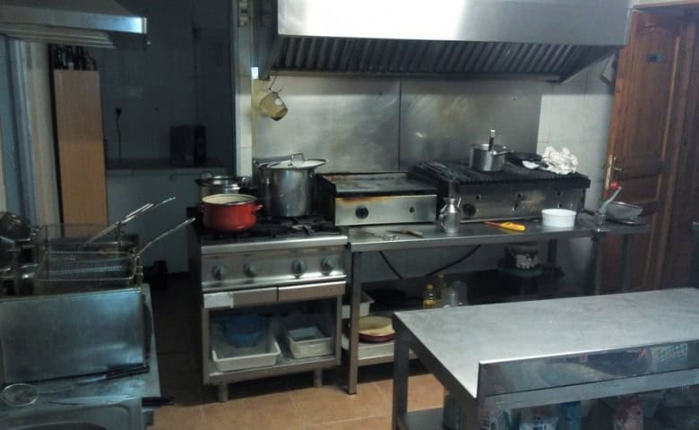 Commercial kitchen with cooking equipment in Las Vertientes, Granada.