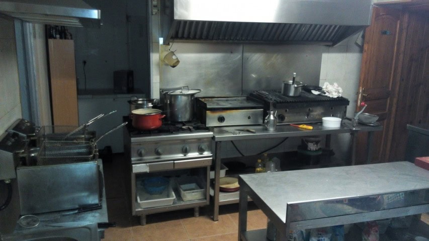 Commercial kitchen with cooking equipment in Las Vertientes, Granada.