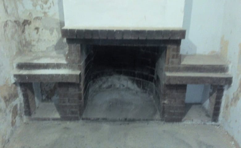 Ancient fireplace in a ruined house located in Cuevas del Campo, Granada, Spain.