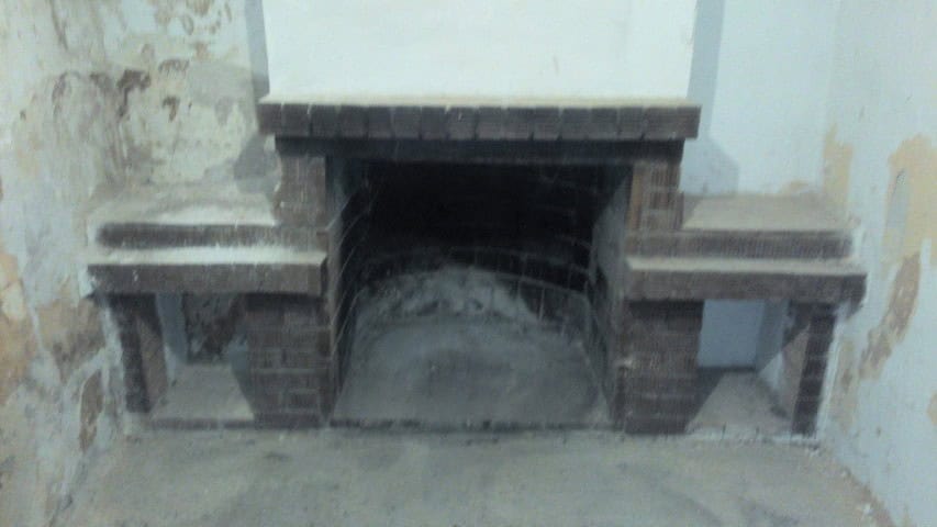 Ancient fireplace in a ruined house located in Cuevas del Campo, Granada, Spain.