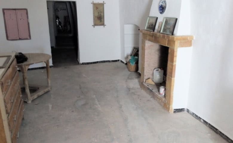 Cave house interior in Freila, Granada, featuring rustic decor and traditional architecture.