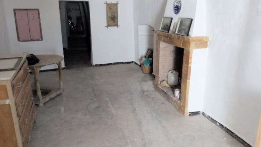 Cave house interior in Freila, Granada, featuring rustic decor and traditional architecture.