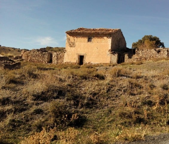 Rustic farm property in Gor, Granada, featuring traditional architecture and expansive land.