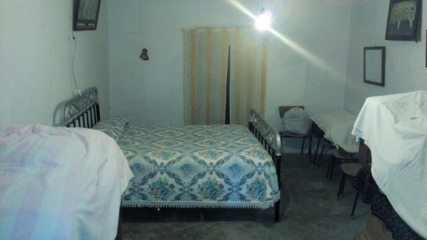 Cave House bedroom in Pulpite, Granada, showcasing rustic interior and unique living space.