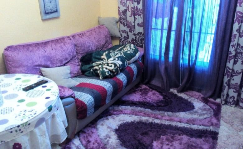 Apartment in Baza, Granada with comfortable living space and vibrant decor.