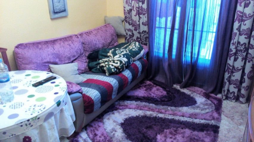 Apartment in Baza, Granada with comfortable living space and vibrant decor.