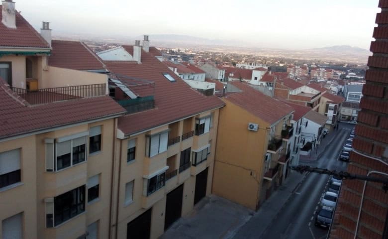 Apartment in Baza, Granada with city views and surrounding rooftops.