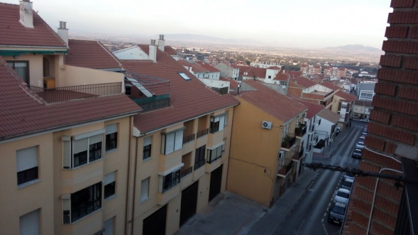 Apartment in Baza, Granada with city views and surrounding rooftops.