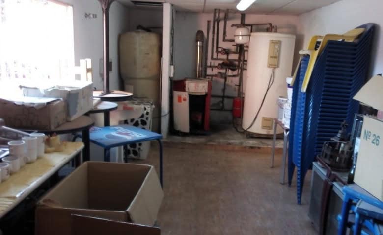 Commercial property for sale in Baza, Granada, featuring storage and utility areas.