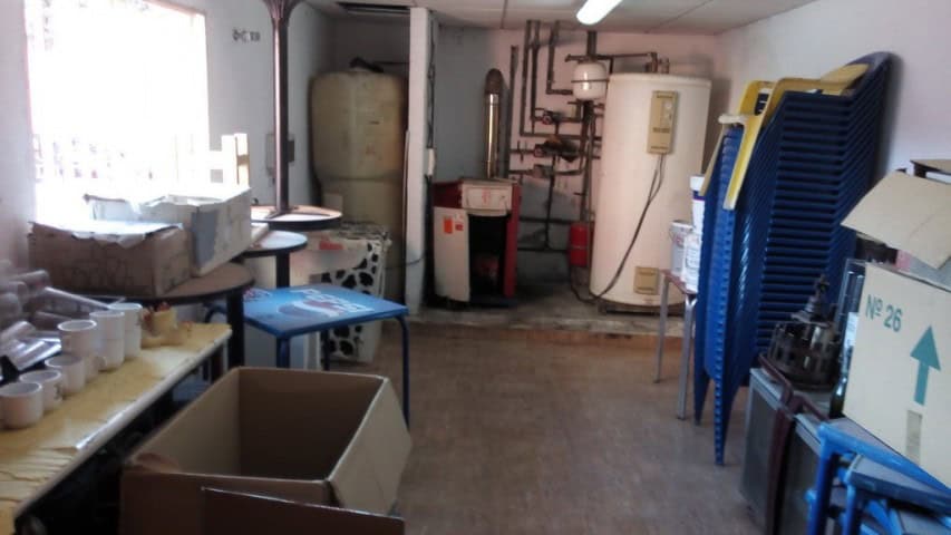 Commercial property for sale in Baza, Granada, featuring storage and utility areas.