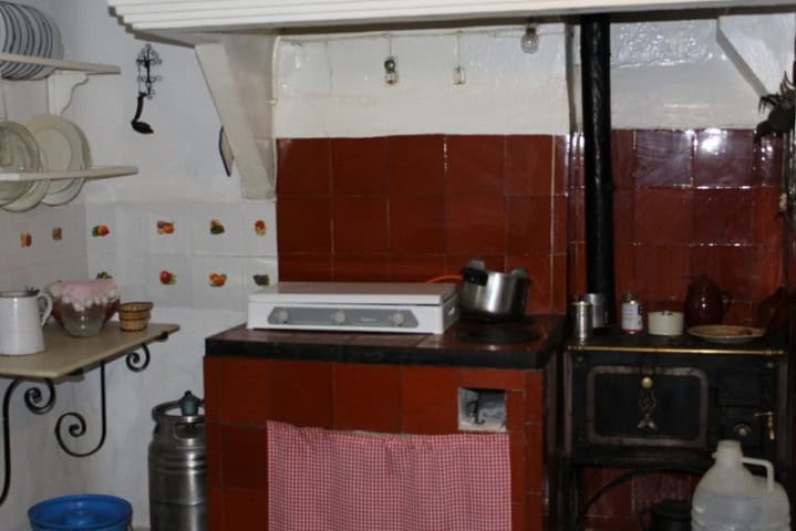 Charming rustic kitchen with traditional tiles and vintage appliances in a beautiful estate in Larva.