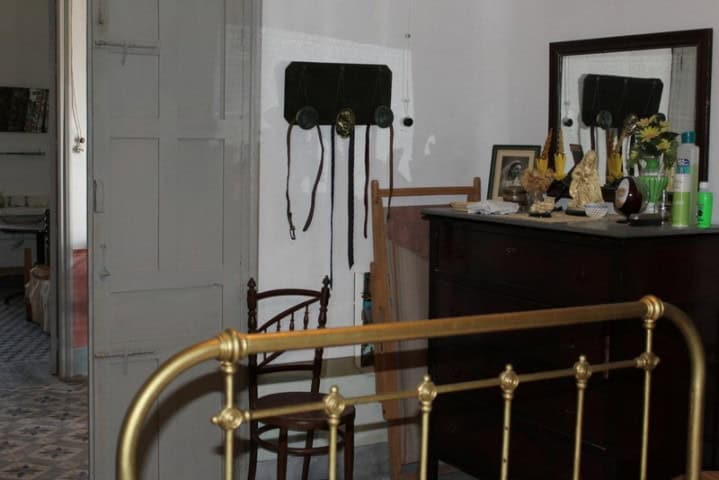 Charming interior of a country estate in Larva, Jaen, featuring vintage furniture and decor.