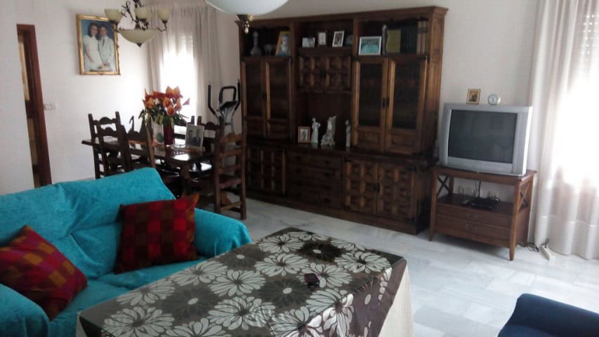 Apartment interior in Baza, Granada with living room and furniture.