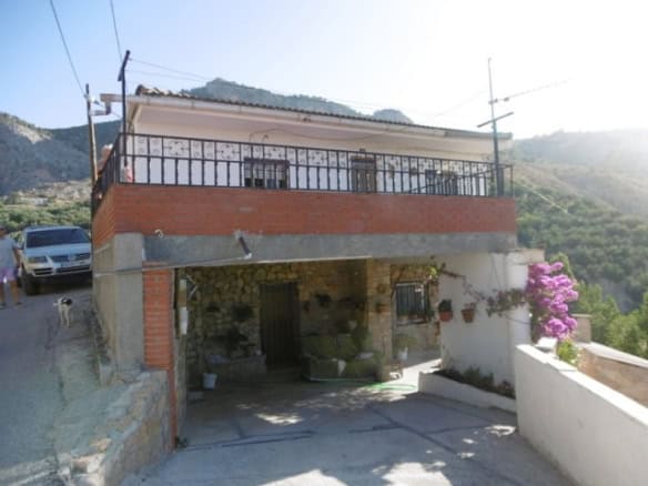 Charming village house in Cuenca, Jaen featuring a spacious balcony and mountain surroundings.