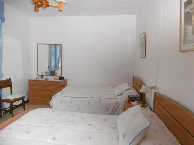 Charming village home with two bedrooms in Belerda, Jaen, featuring simple furnishings and a cozy at.