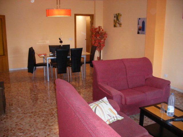 Bright living room with comfortable seating and modern decor.
