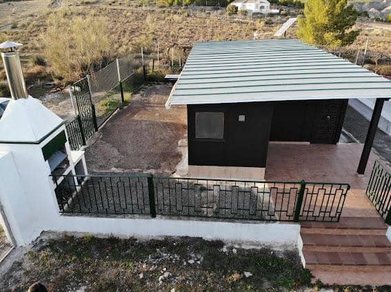 Log home in Freila, Granada with modern design and scenic surroundings.
