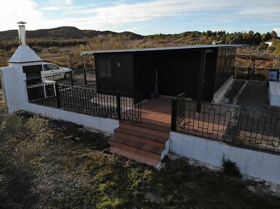 Charming black log cabin in Freila, Granada with outdoor terrace and scenic mountain views. Perfect.