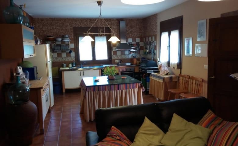 Cozy kitchen and living area in a rural Tijola property, featuring traditional decor and ample natur.