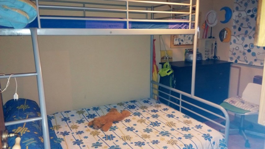 Beautiful rural property in Tijola, Almeria, featuring a cozy bedroom with a bunk bed and playful de.