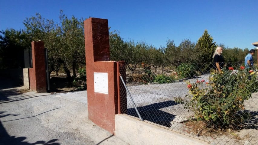 Rural property entrance in Tijola, Almeria with garden and gate.