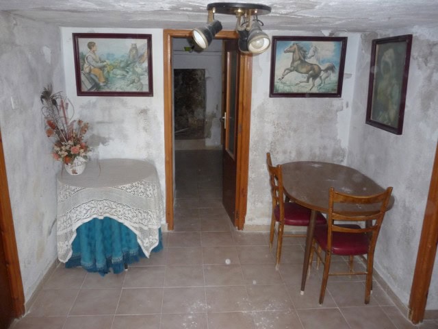 Charming town house interior in Baza, Granada, featuring vintage decor and artwork. Perfect for a co.