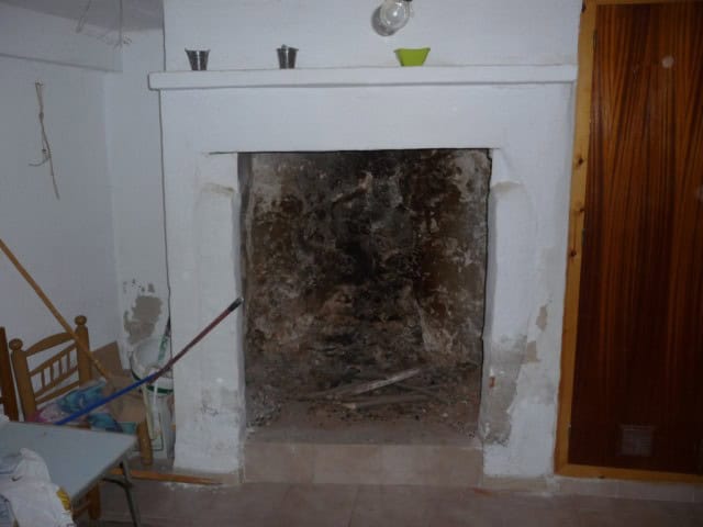 Traditional fireplace in a town house in Baza, Granada, showcasing rustic charm and authentic Andalu.