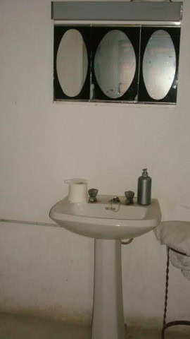 Interior view of a rustic rural property in Purchena, Almeria, showing a simple bathroom setup.