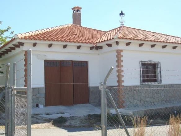Rural property in Olula del Rio, Almeria featuring a charming traditional house with a tiled roof an.