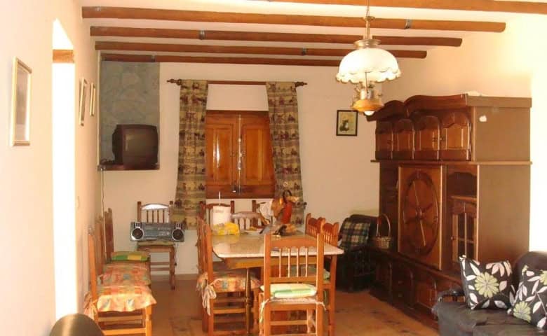 Charming rural property living room in Olula del Rio, Almeria, featuring traditional furniture and w.