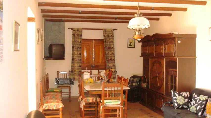 Charming rural property living room in Olula del Rio, Almeria, featuring traditional furniture and w.