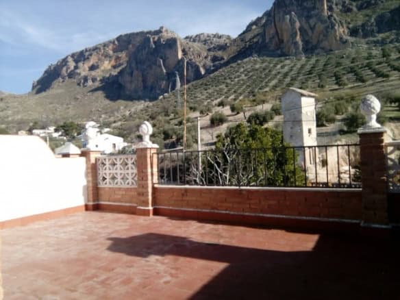 Village property terrace with mountain views in Rosales, Jaen.