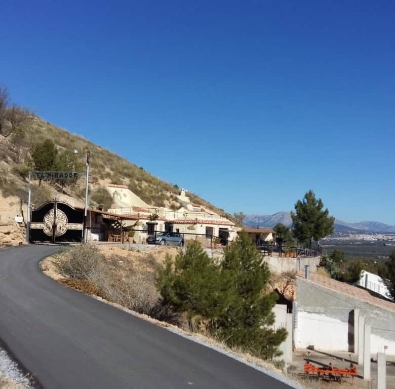 Cave house located in Fontanar, Jaen, with scenic mountain views and rural surroundings.
