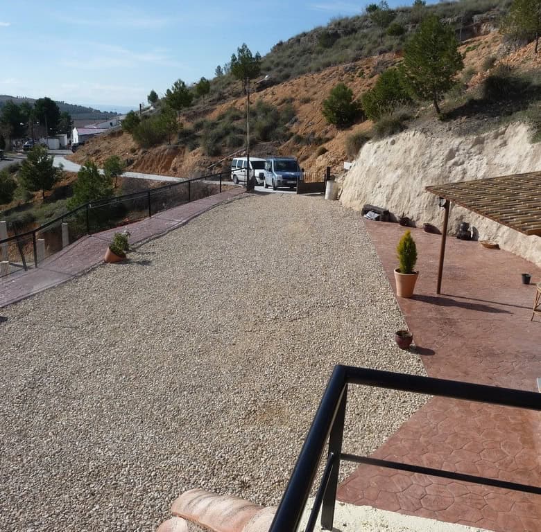 Charming cave house in Fontanar, Jaen, with scenic mountain views and rustic outdoor space. Perfect.