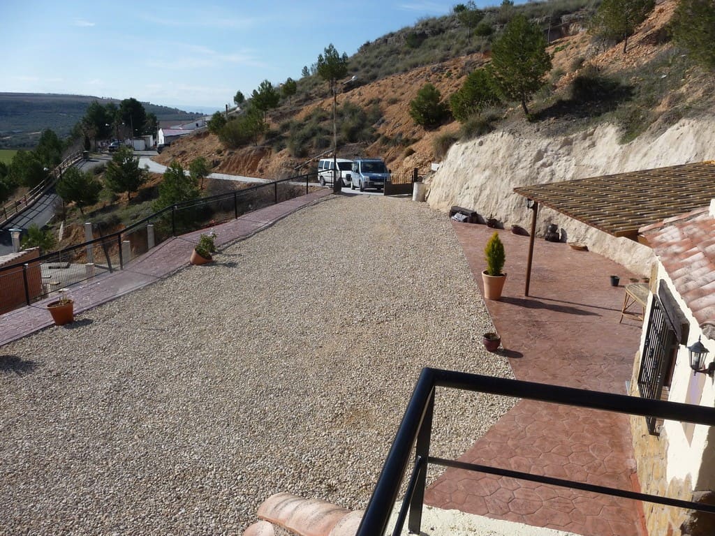 Charming cave house in Fontanar, Jaen, with scenic mountain views and rustic outdoor space. Perfect.