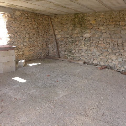 Ruin in Cullar, Granada with stone walls and concrete ceiling.