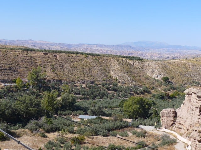 Cave house nestled in the scenic landscape of Freila, Granada, surrounded by natural beauty and rugg.