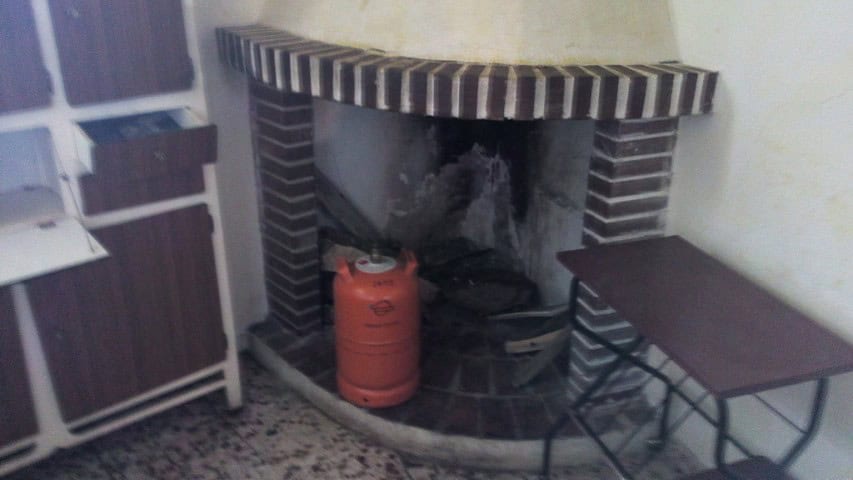 Bright fireplace in a traditional village home in Zujar, Granada.