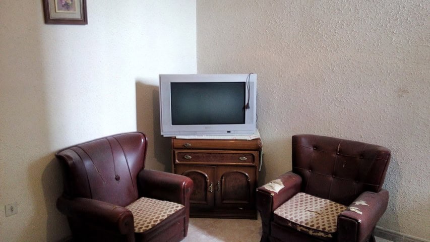 Charming village property in Zujar, Granada, featuring a cozy living room with vintage furniture and.