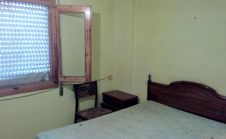 Charming village home in Zujar, Granada with cozy bedroom and traditional decor.