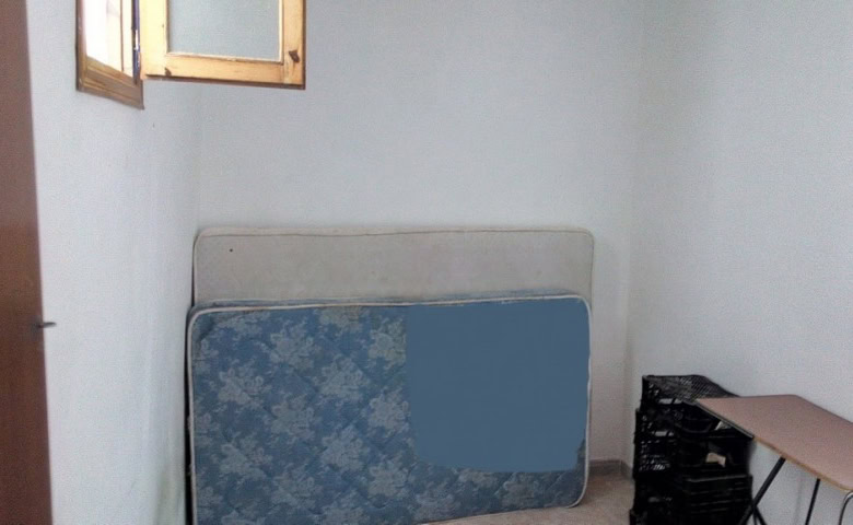 Charming village property in Zujar, Granada with potential for renovation and scenic mountain views.