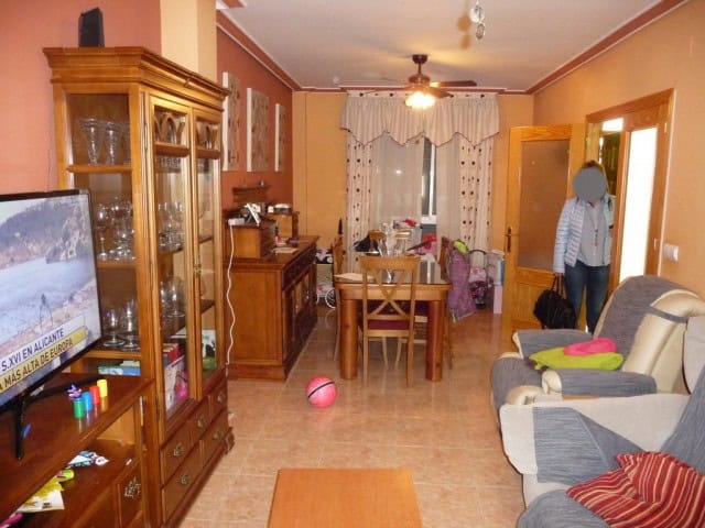 Cozy interior of a village property in Zujar, Granada, featuring a living room with traditional furn.