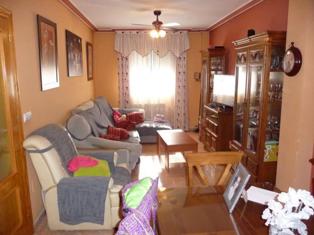 Village Property in Zujar, Granada with cozy living room and traditional decor.