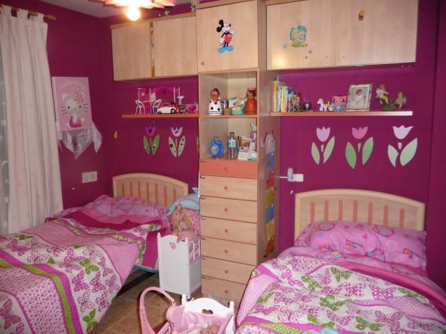 Village Property in Zujar, Granada with cozy bedrooms and colorful decor.