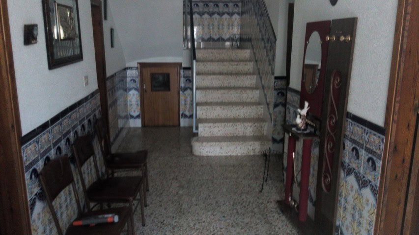 Charming village property in Zujar, Granada, featuring traditional decor and cozy interiors.