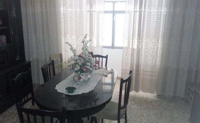 Interior view of a cozy village home dining room in Zujar, Granada.